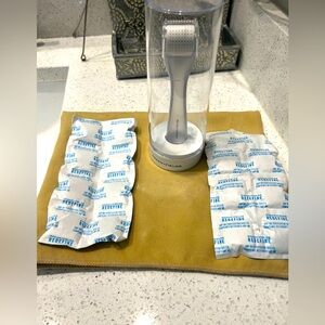 Rodan and Fields Derm Roller in case with cleaning tablets (2 full packs)